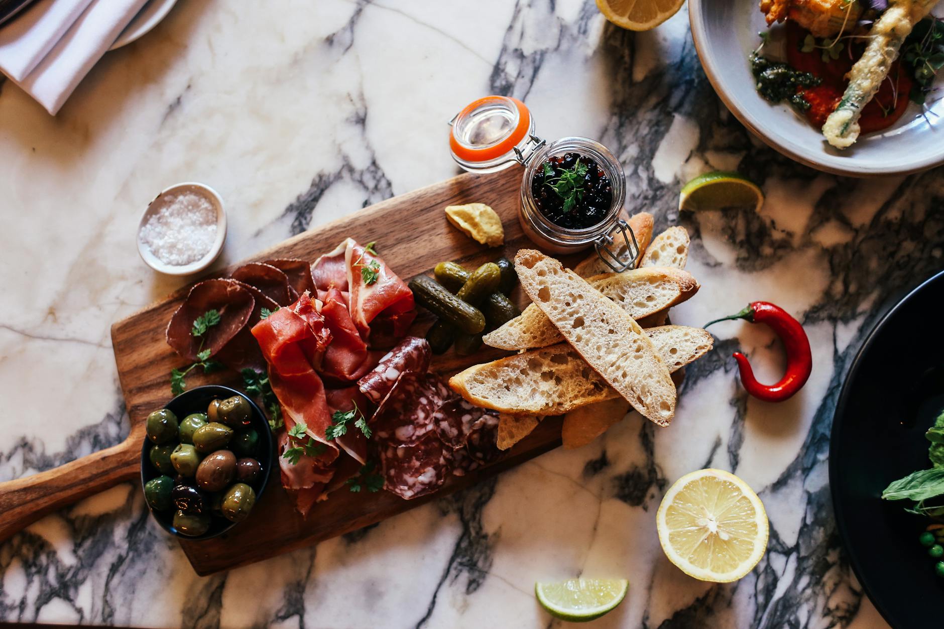 meat platter with bread and olives